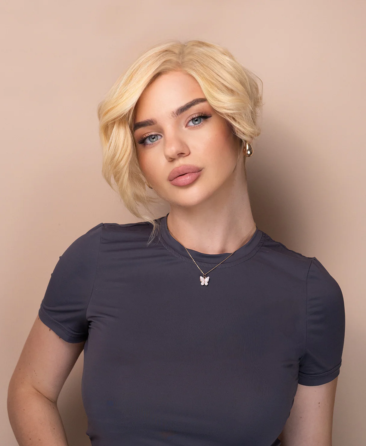 asymmetric wedge human wig - 6" light blonde.